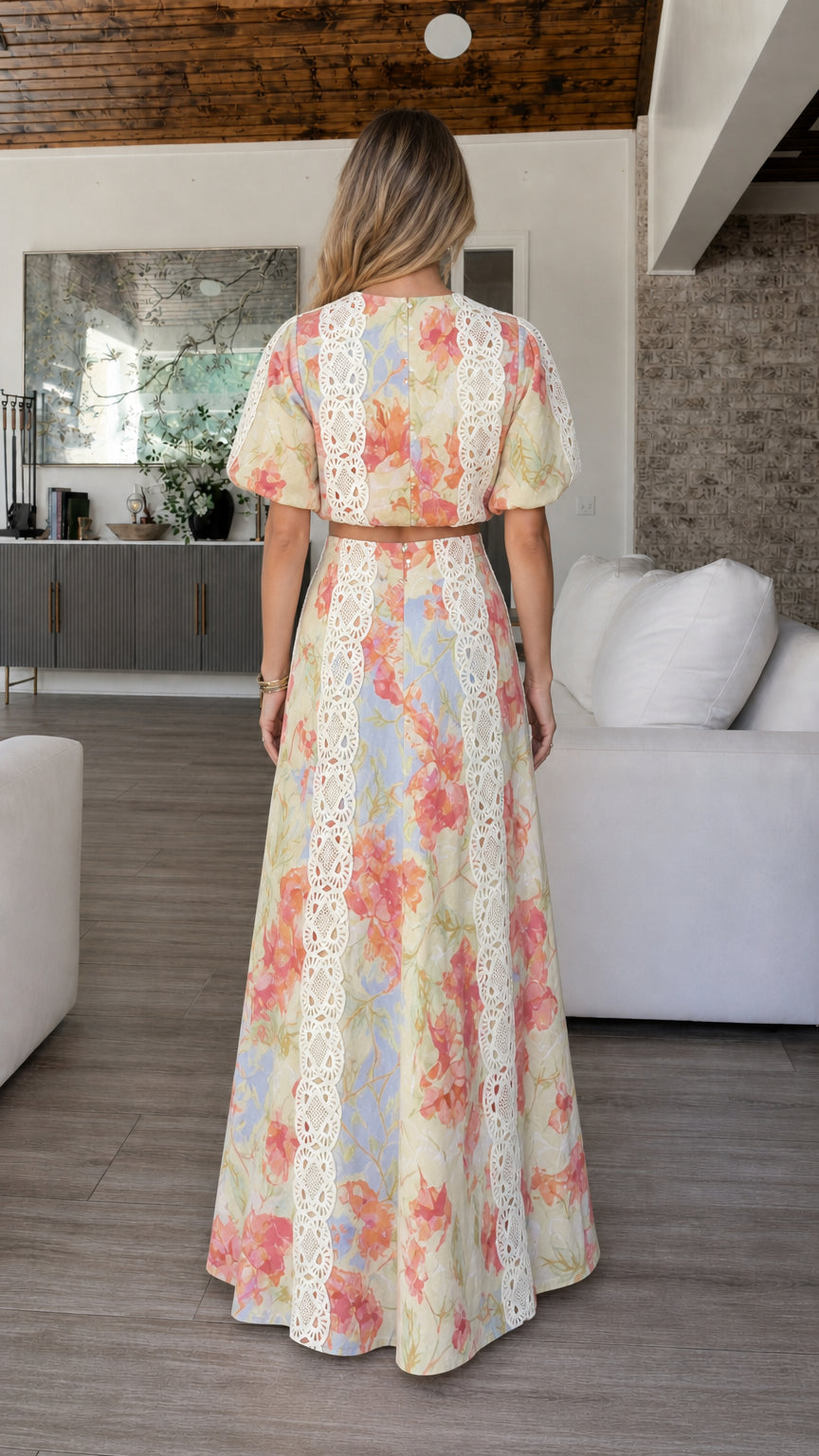 Back view of model showcasing maxi skirt and top silhouette