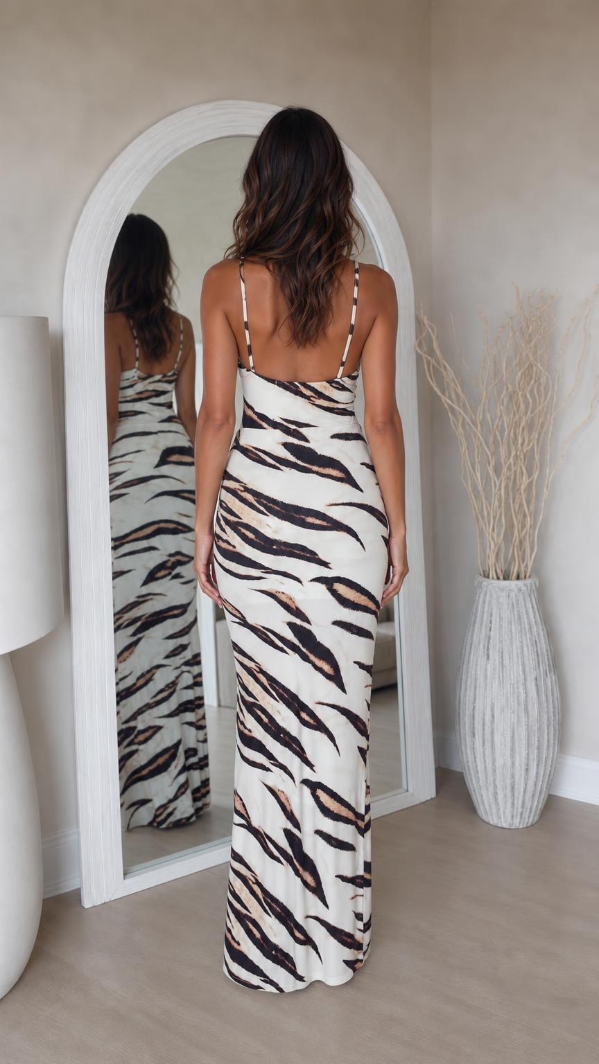 Woman wearing white tiger print maxi dress, back view