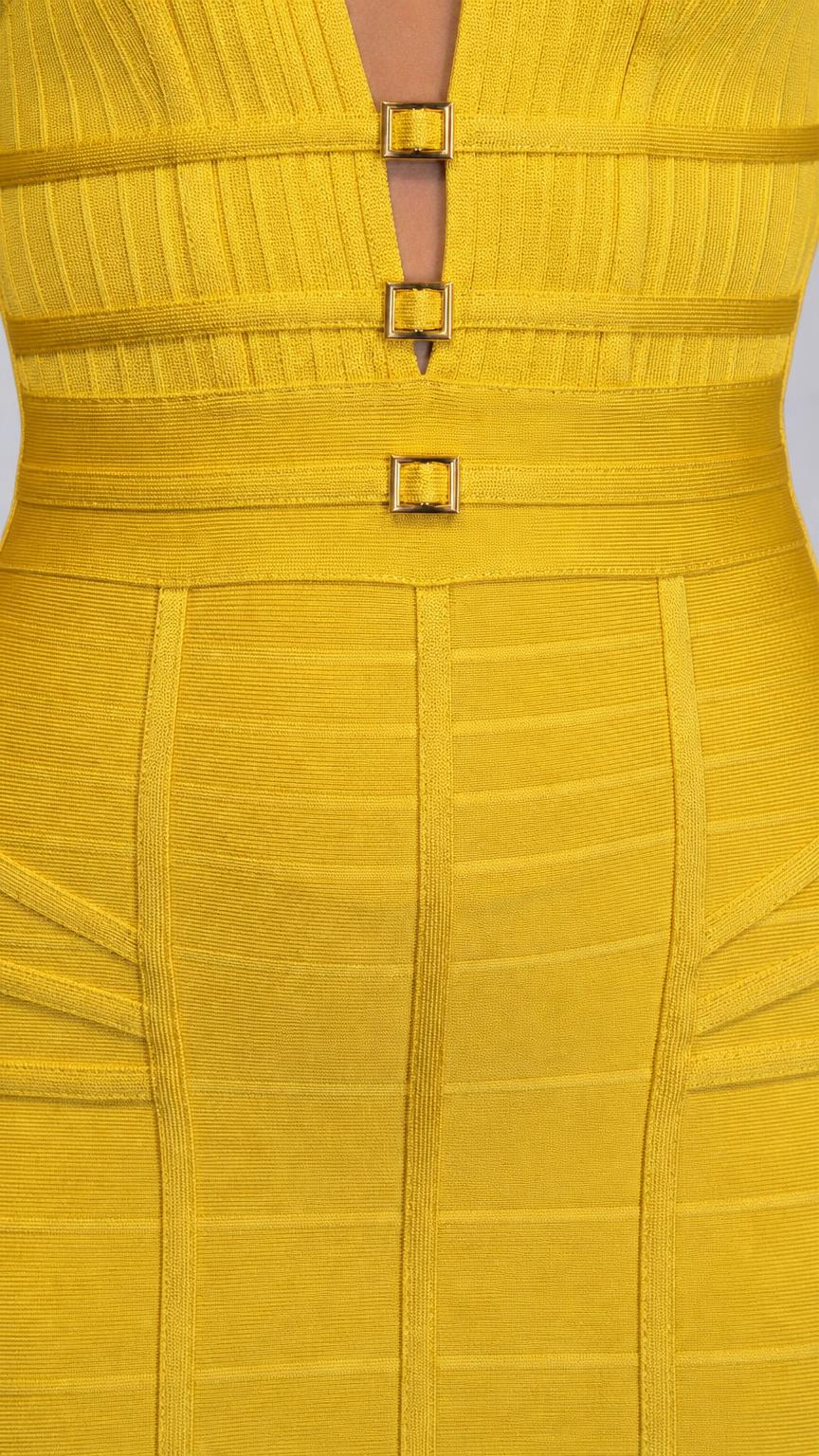 Close-up of bodice detailing, neckline, and gold buckles on yellow dress