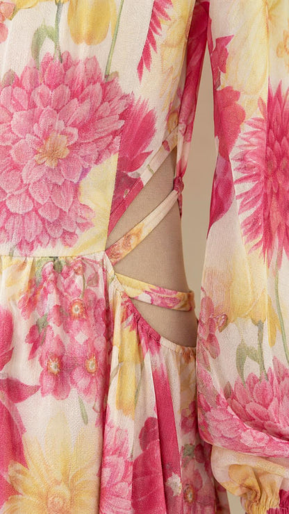 Close-up detail of side waist cutouts on floral maxi dress