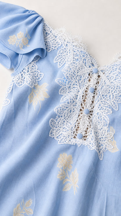 Close-up of lace bodice and button trim on Light Blue dress