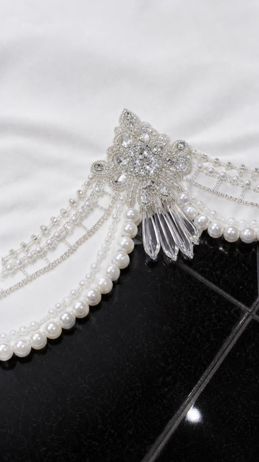 Close-up detail of rhinestone and faux pearl embellished hem