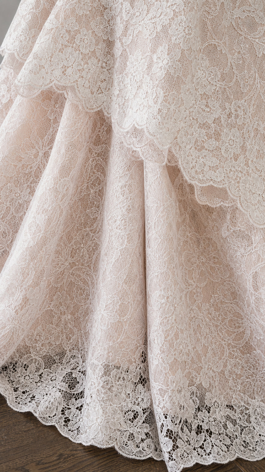 Close up detail of layered scalloped lace hem
