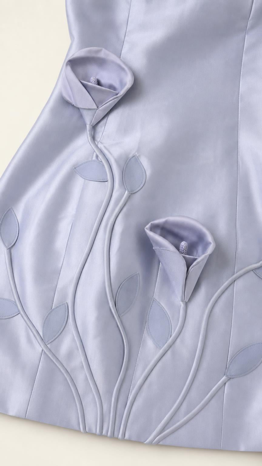 Close-up detail of 3D floral appliques and embroidery on Light Blue dress