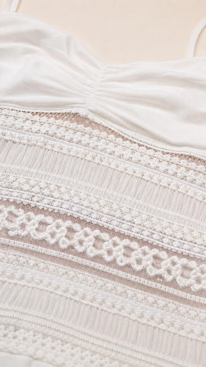 Close-up detail of lace midsection and ruched bodice