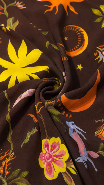 Close up texture view of the brown celestial print fabric