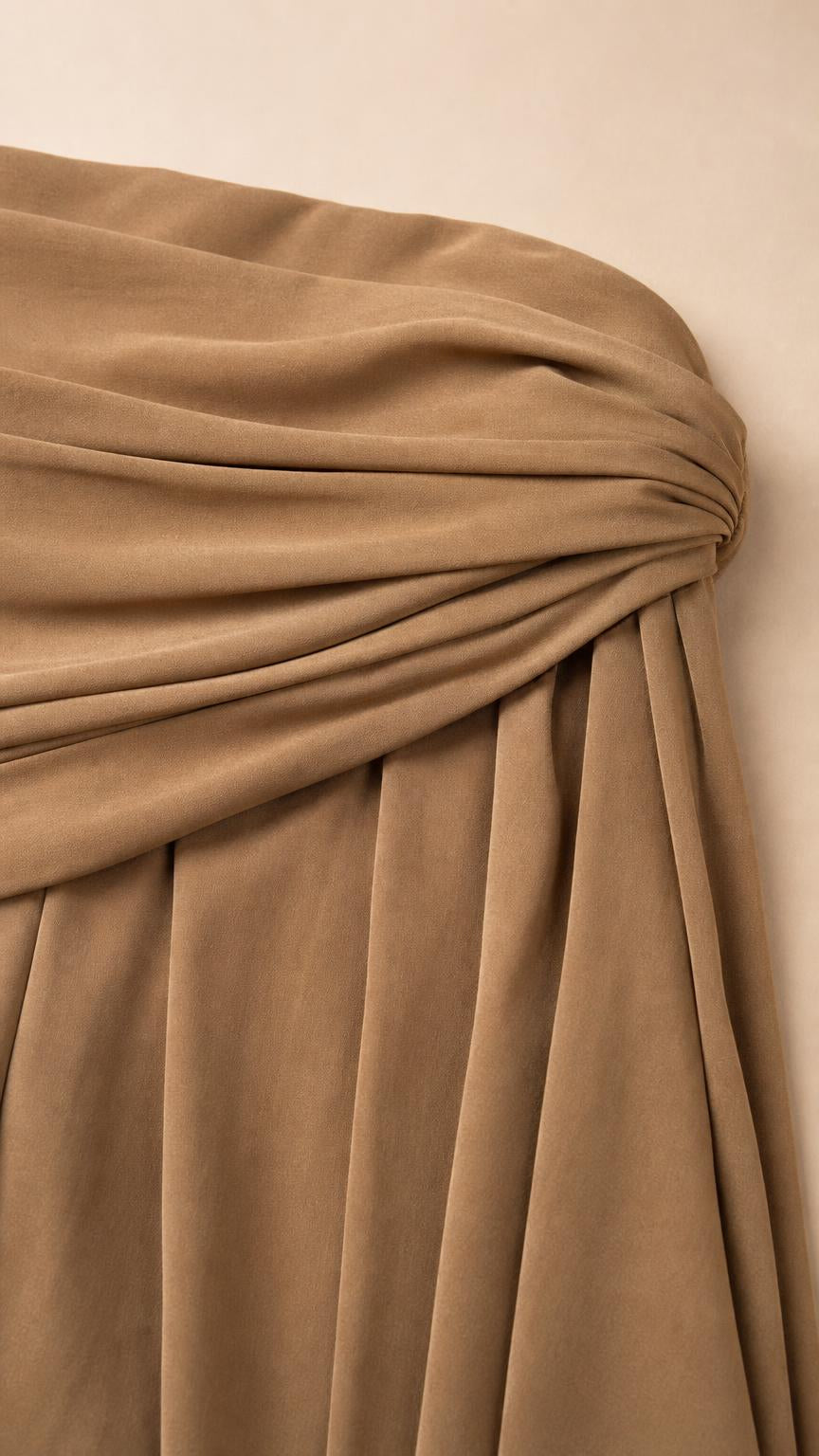 Close-up detail of the draped and knotted bodice texture