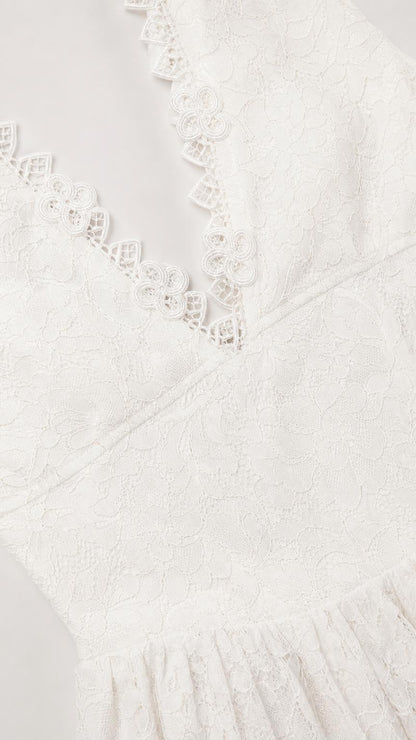Close-up detail of V-neckline scalloped lace trim