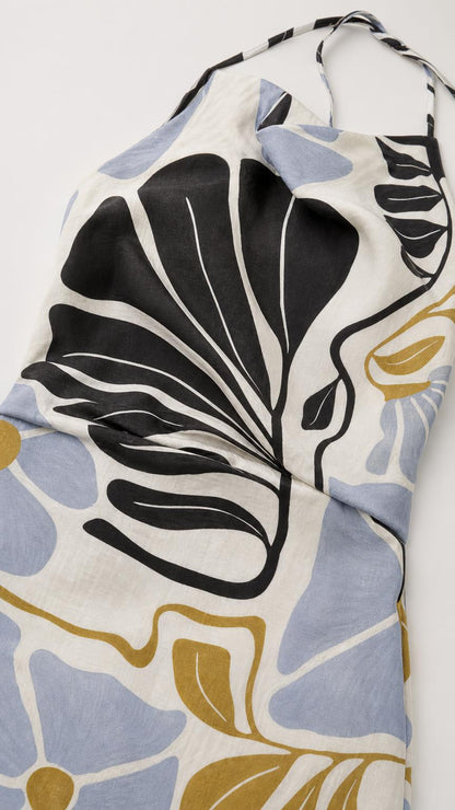 Close-up of fabric texture and abstract floral pattern on white background