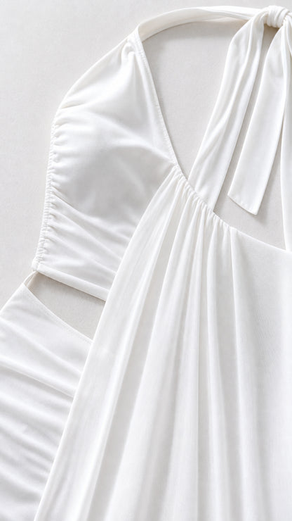 Close-up detail of white fabric, bodice, and cutout construction