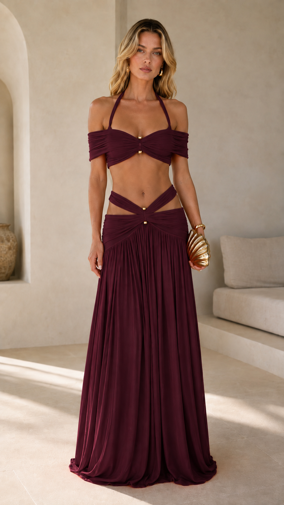 Woman wearing deep burgundy halter two-piece resort outfit