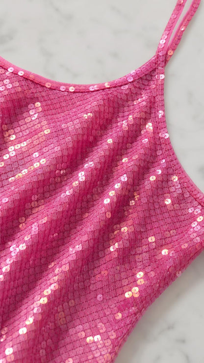Close-up of hot pink sequin fabric and neckline detail