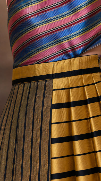 Close-up detail of stripe pattern and pleated skirt
