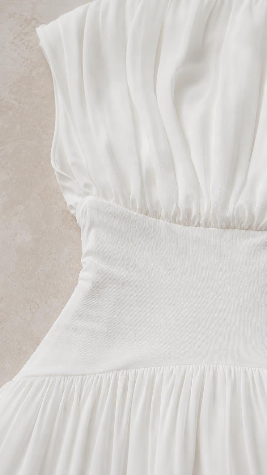 Close-up detail of gathered bodice and wide waistband