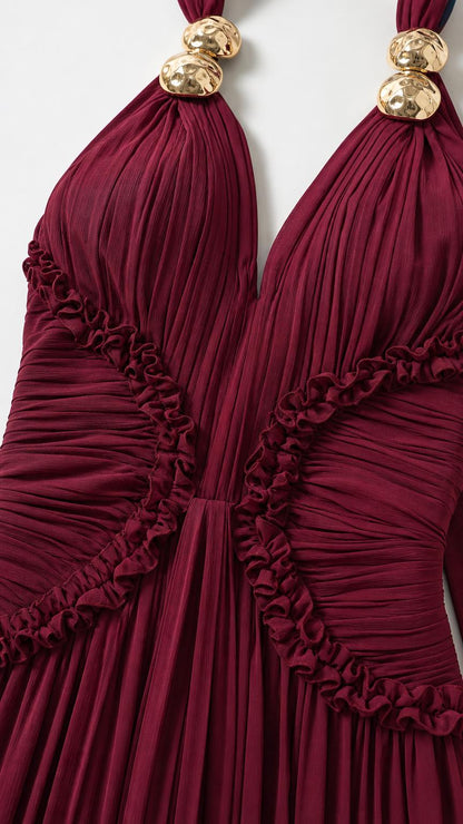 Close-up of gold hardware and pleated bodice detail