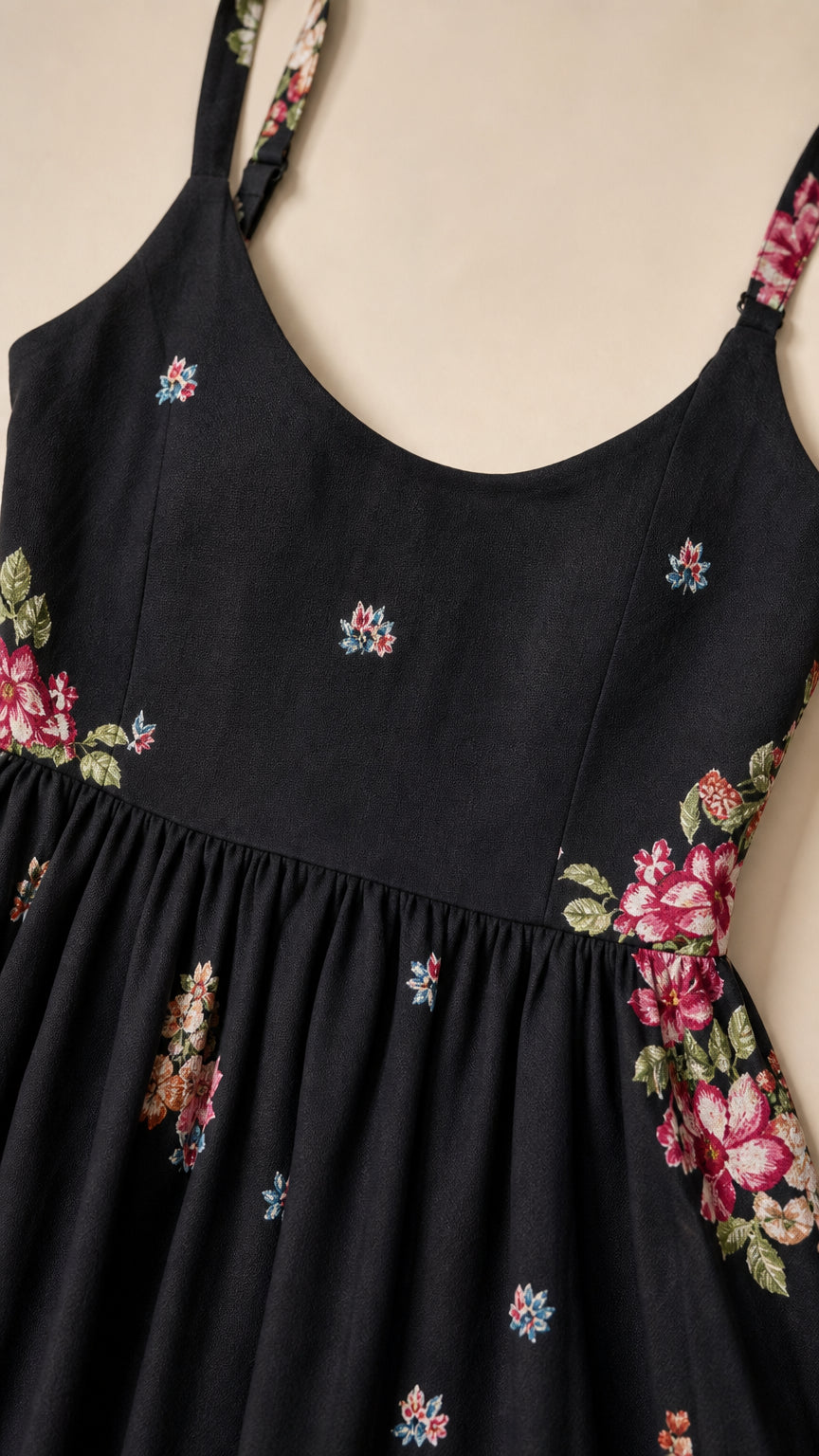 Close up of bodice and embroidery detail on black dress
