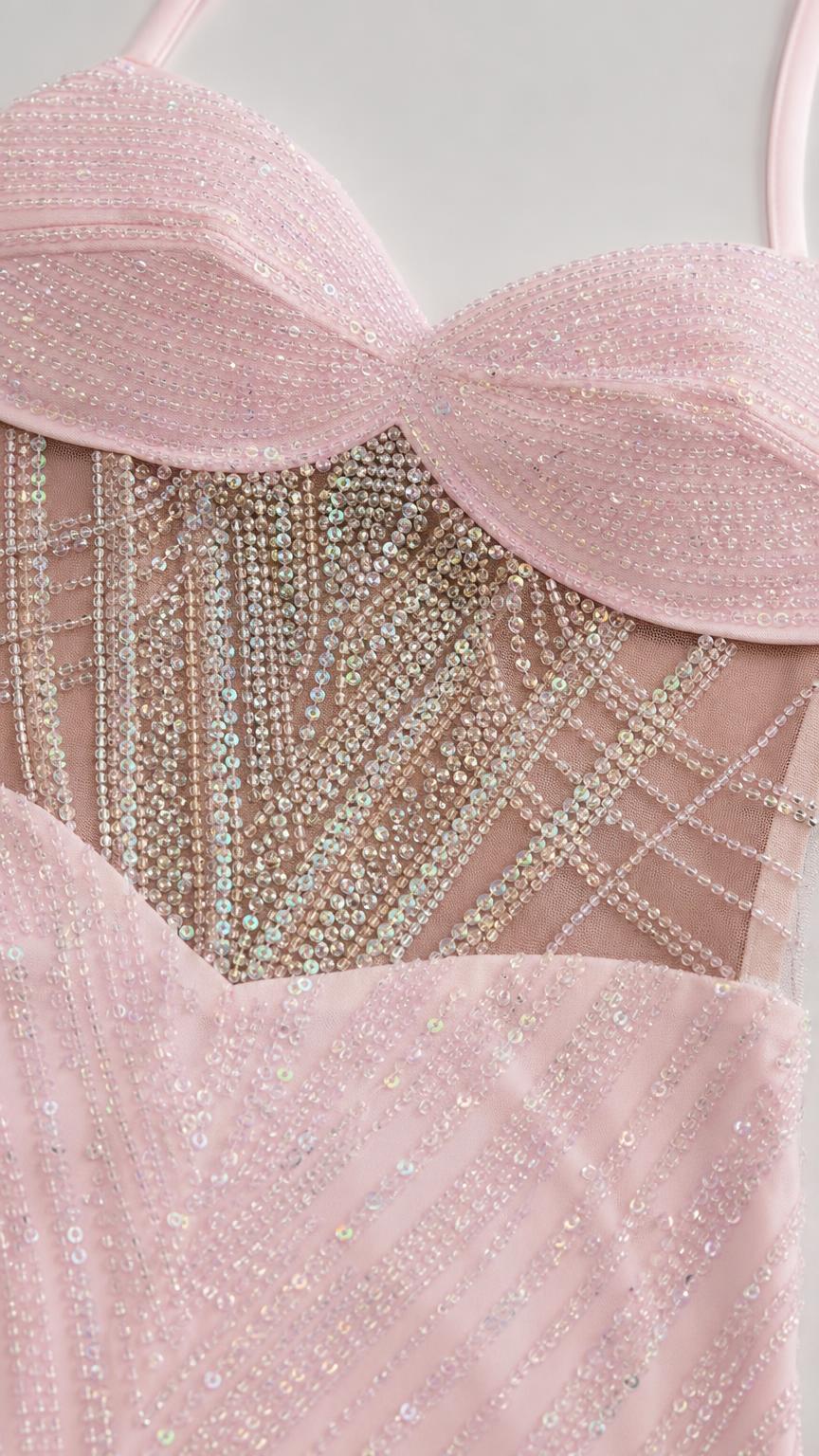 Close-up of sheer rhinestone embellished corset waist and sweetheart neckline