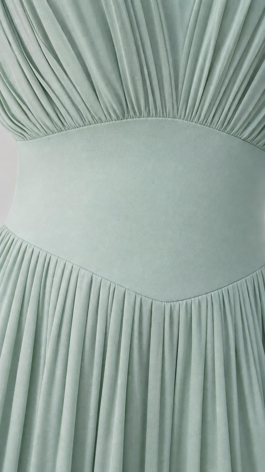 Close-up detail of bodice pleating and waist band on Sage Green dress