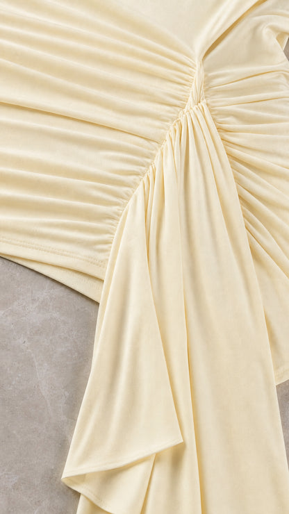 Close up of ruching and fabric detail on champagne dress