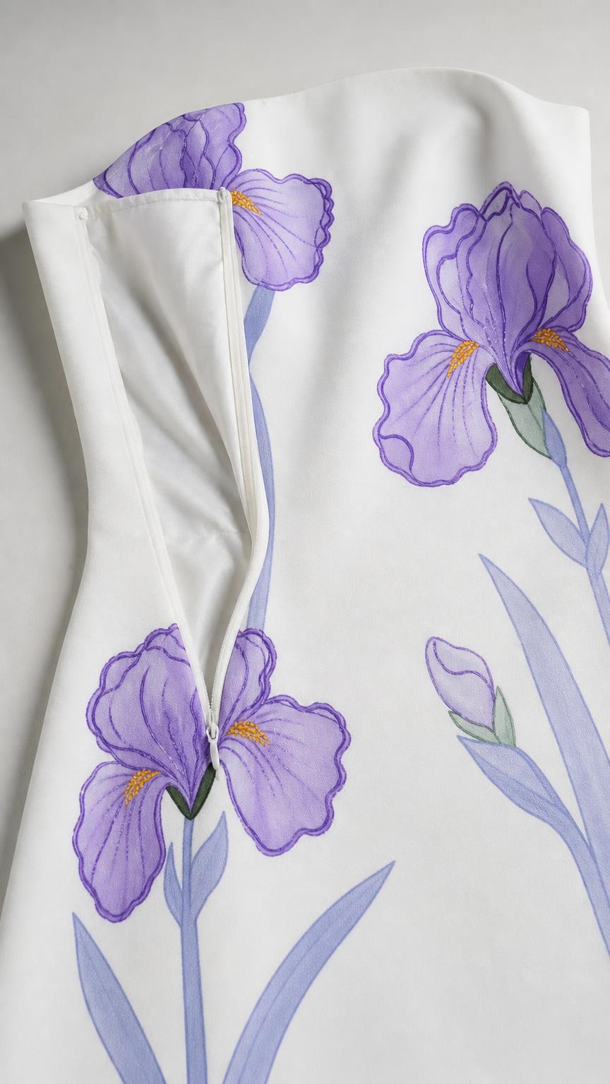 Close-up detail of side zipper and floral print on White dress
