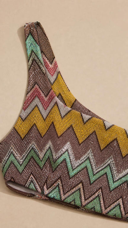 Close-up of metallic chevron knit pattern fabric detail