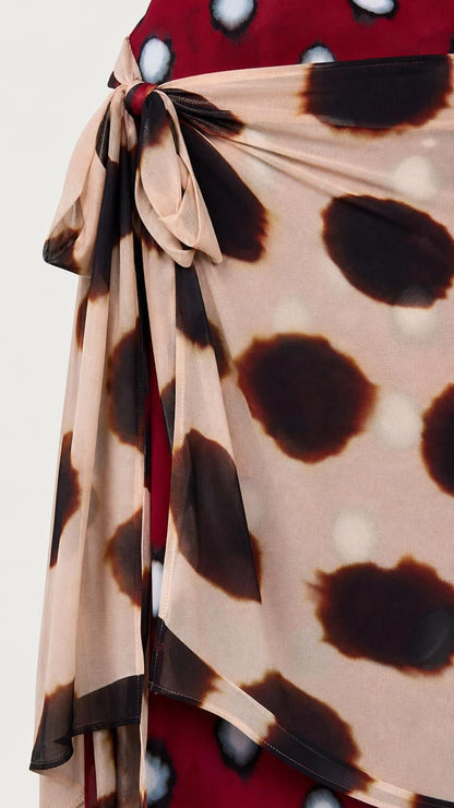 Close-up detail of side tie and polka dot fabric pattern