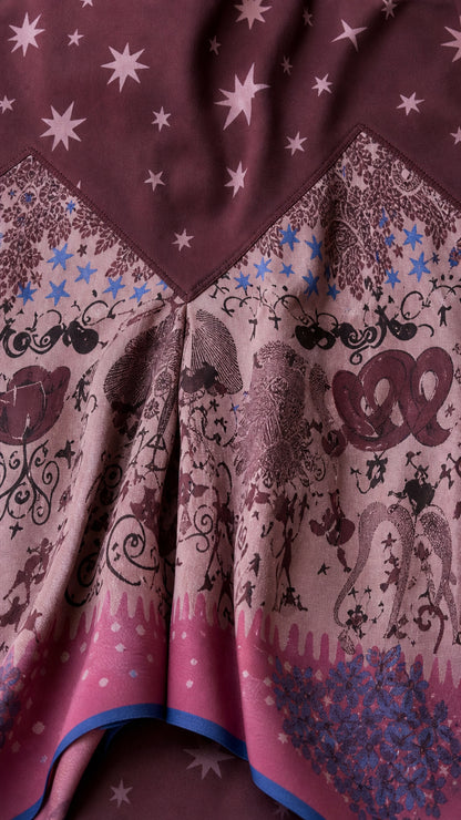 Close up fabric detail showing star print and asymmetric hem pattern