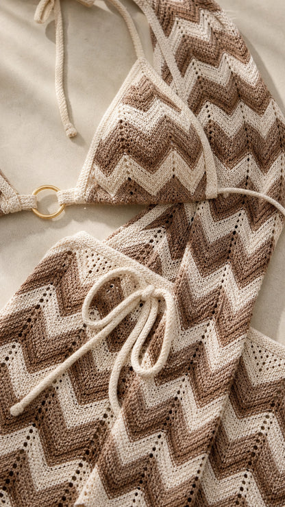 Close-up detail of beige chevron pattern and hardware