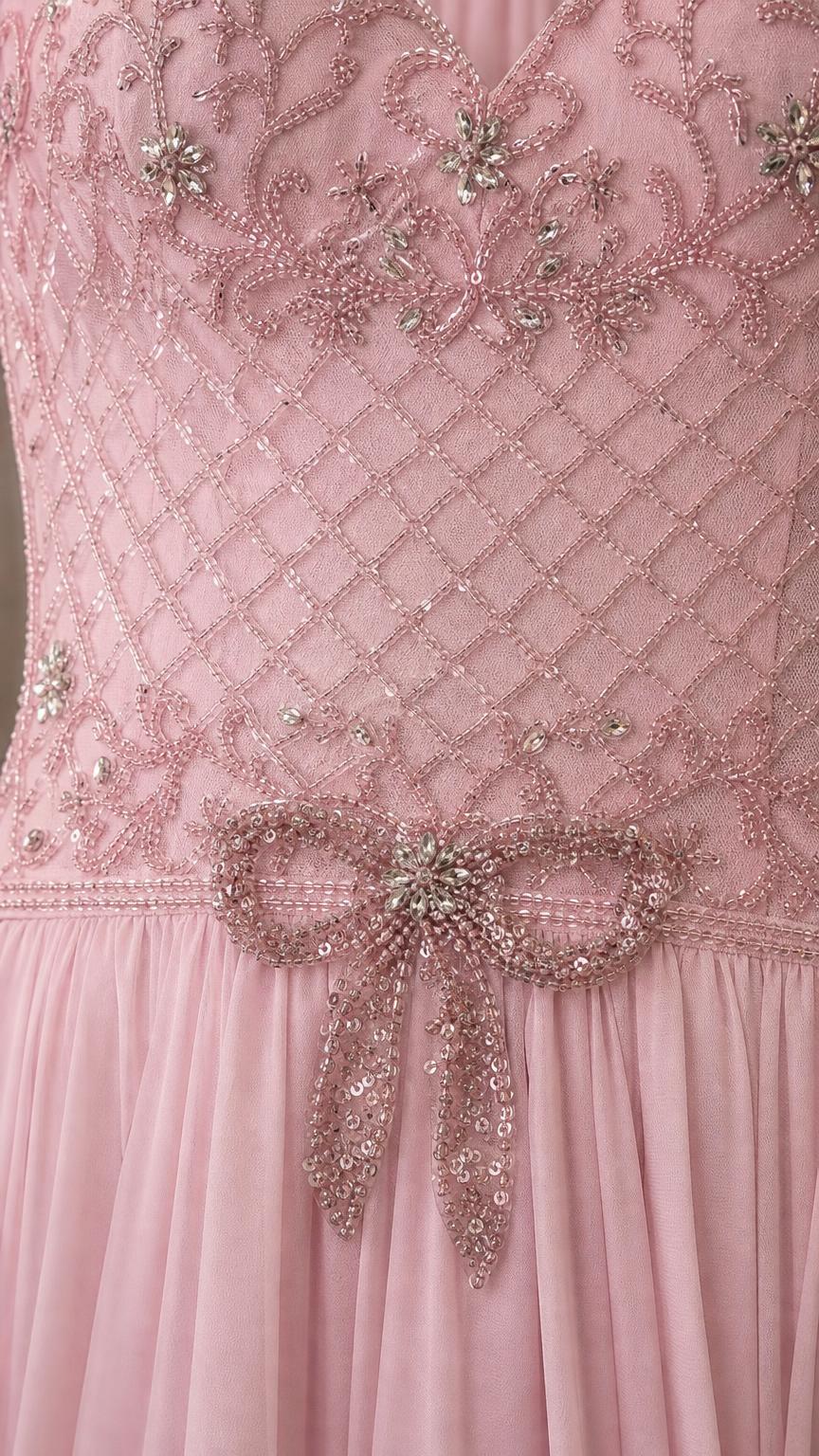 Close-up of beaded bodice and waist bow detail