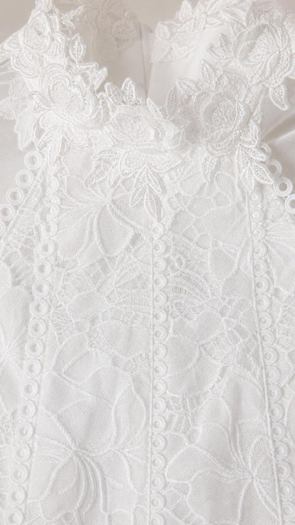 Close up texture view of white floral lace fabric details