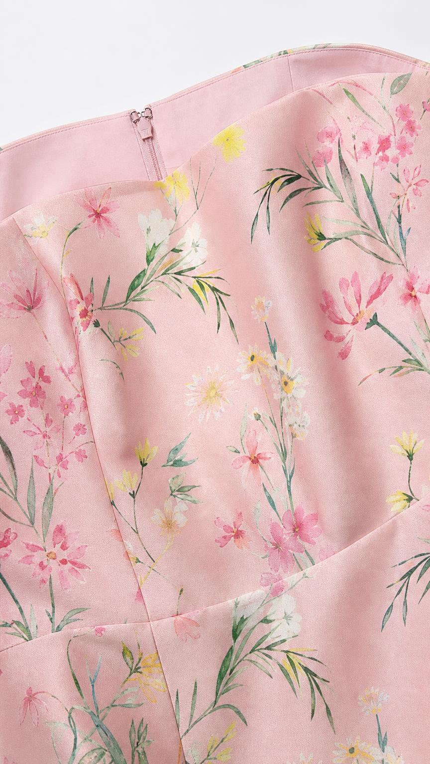 Close up detail of pink floral print fabric and neckline
