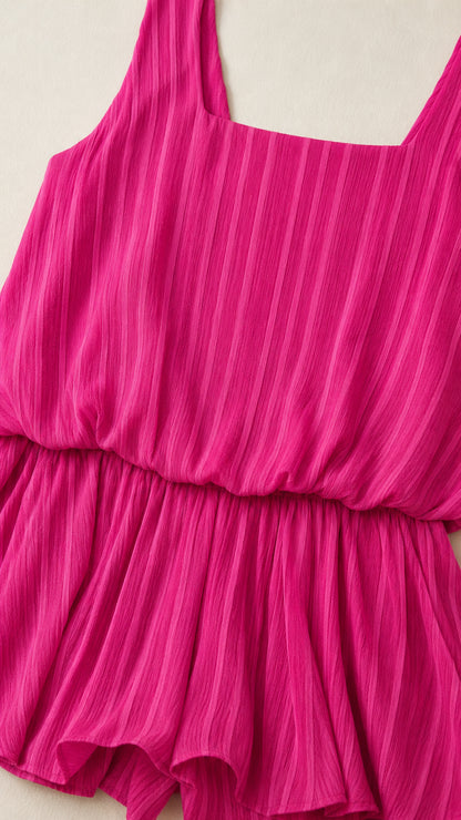 Close-up detail of square neckline and elastic waist on Fuchsia romper