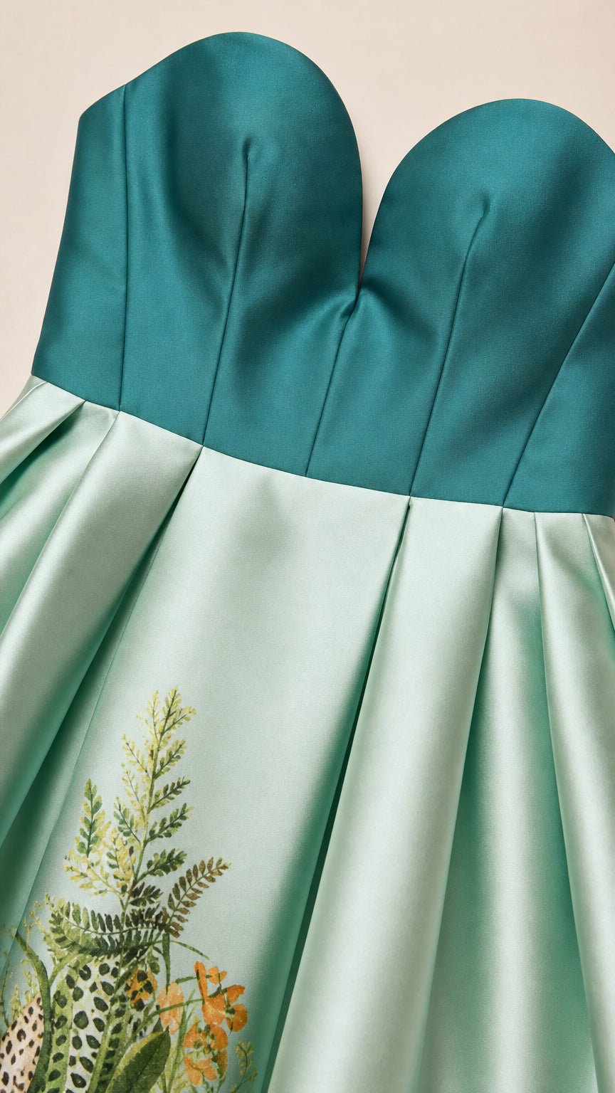 Close-up detail of the sweetheart bodice and embroidered skirt hem