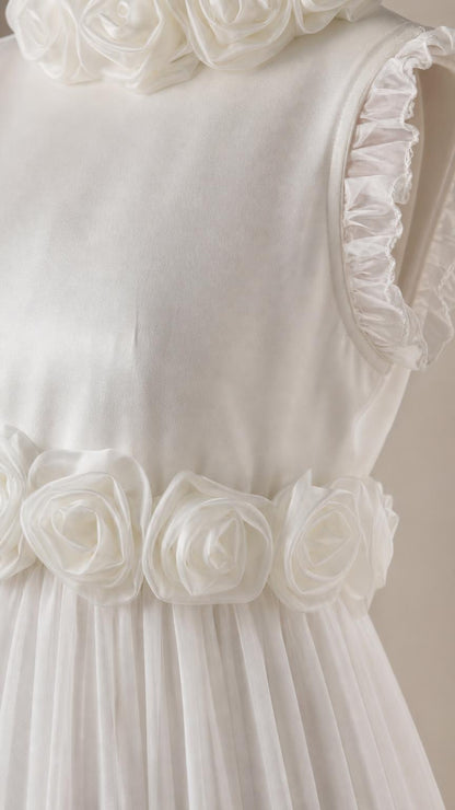 Close up of 3D rosette waist detail and ruffled shoulder