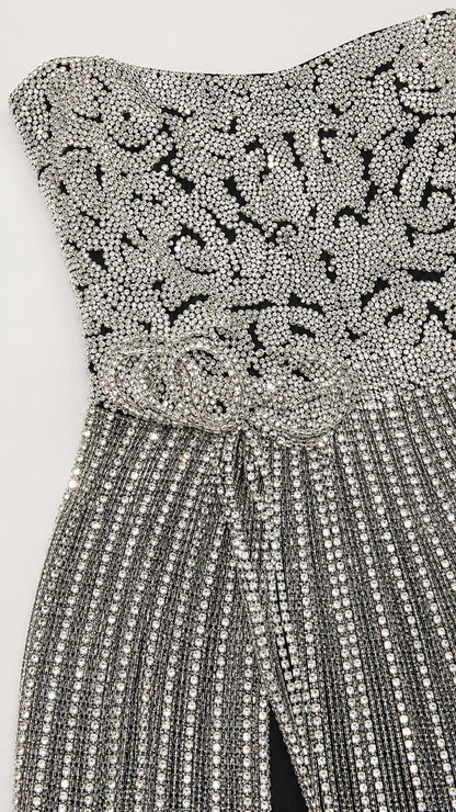 Close-up detail of the intricate bodice beadwork and rhinestone patterns