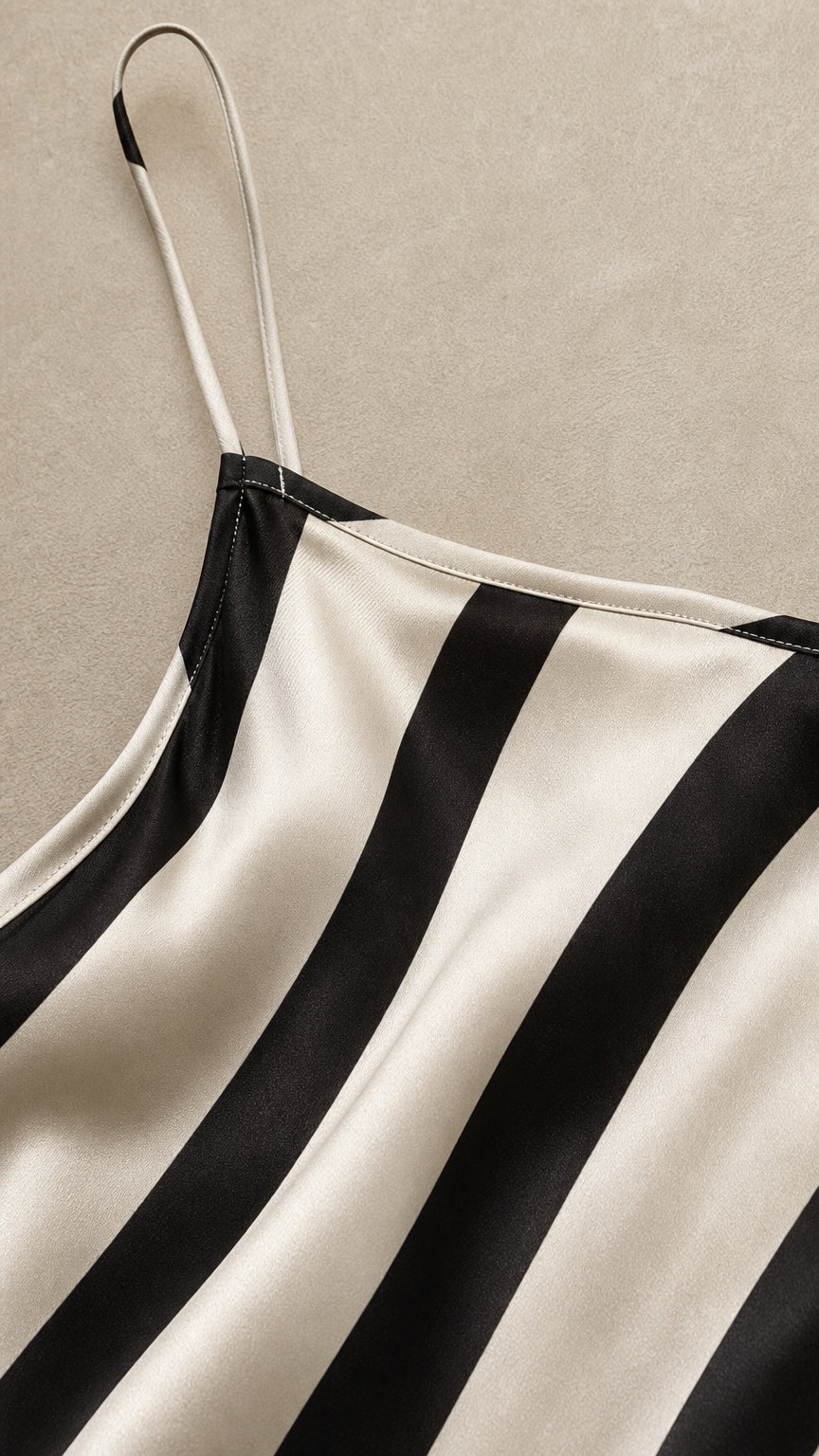 Close-up detail of spaghetti straps and neckline on stripe slip dress