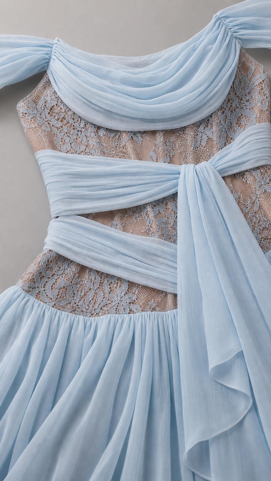 Close-up detail of sheer lace bodice and ruched chiffon sash