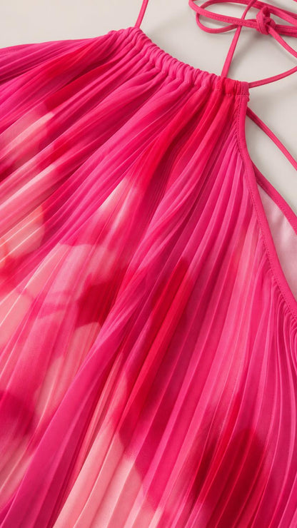 Close-up detail of pleated texture and halter neckline in fuchsia
