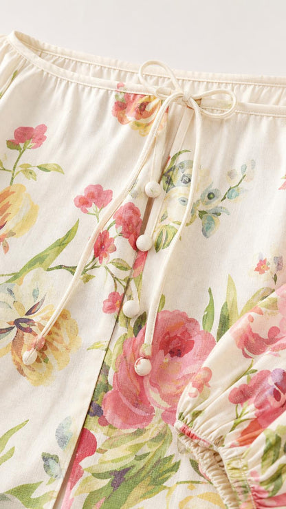 Close-up detail of cream floral top neckline and bead drawstring