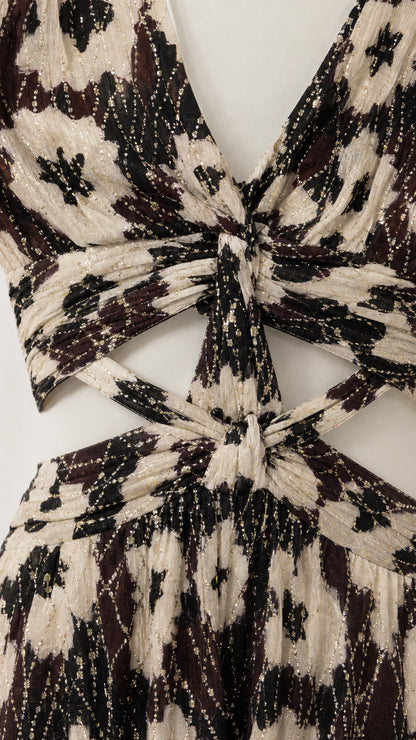 Close-up detail of V-neckline and waist cutout on black floral dress