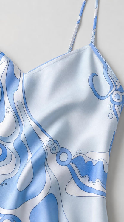 Close-up detail of smooth satin fabric and abstract print