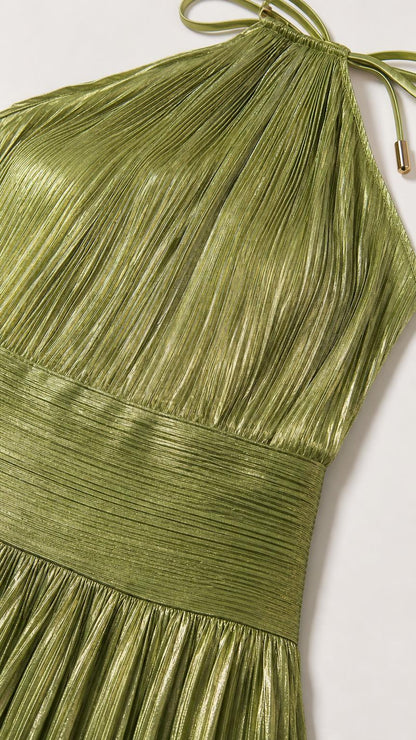 Close-up of green metallic pleated fabric and halter neck tie