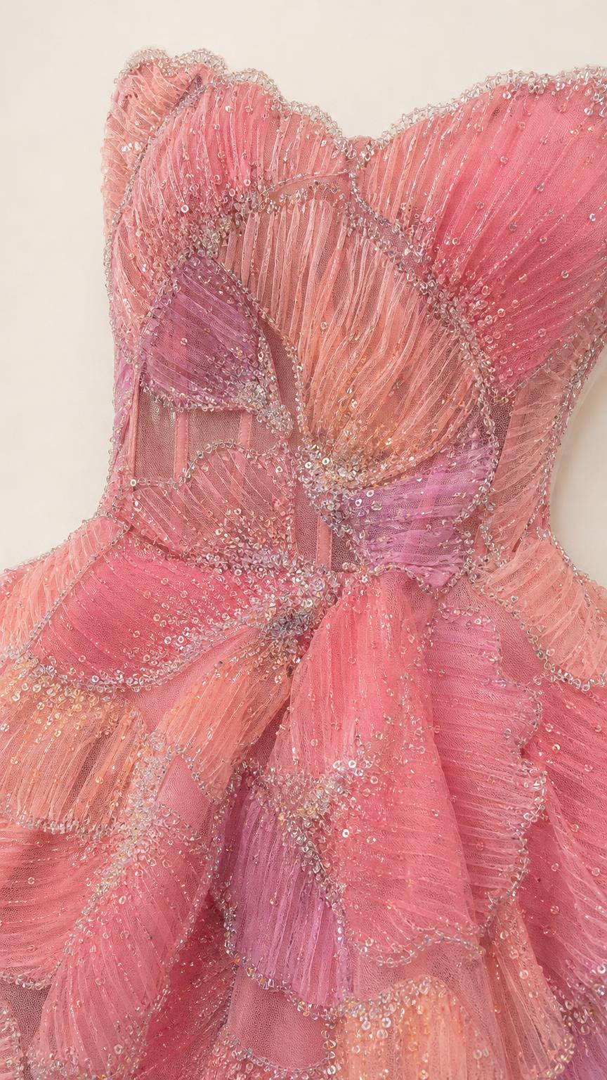 Close-up detail of the pink sequin and beaded bodice and peplum