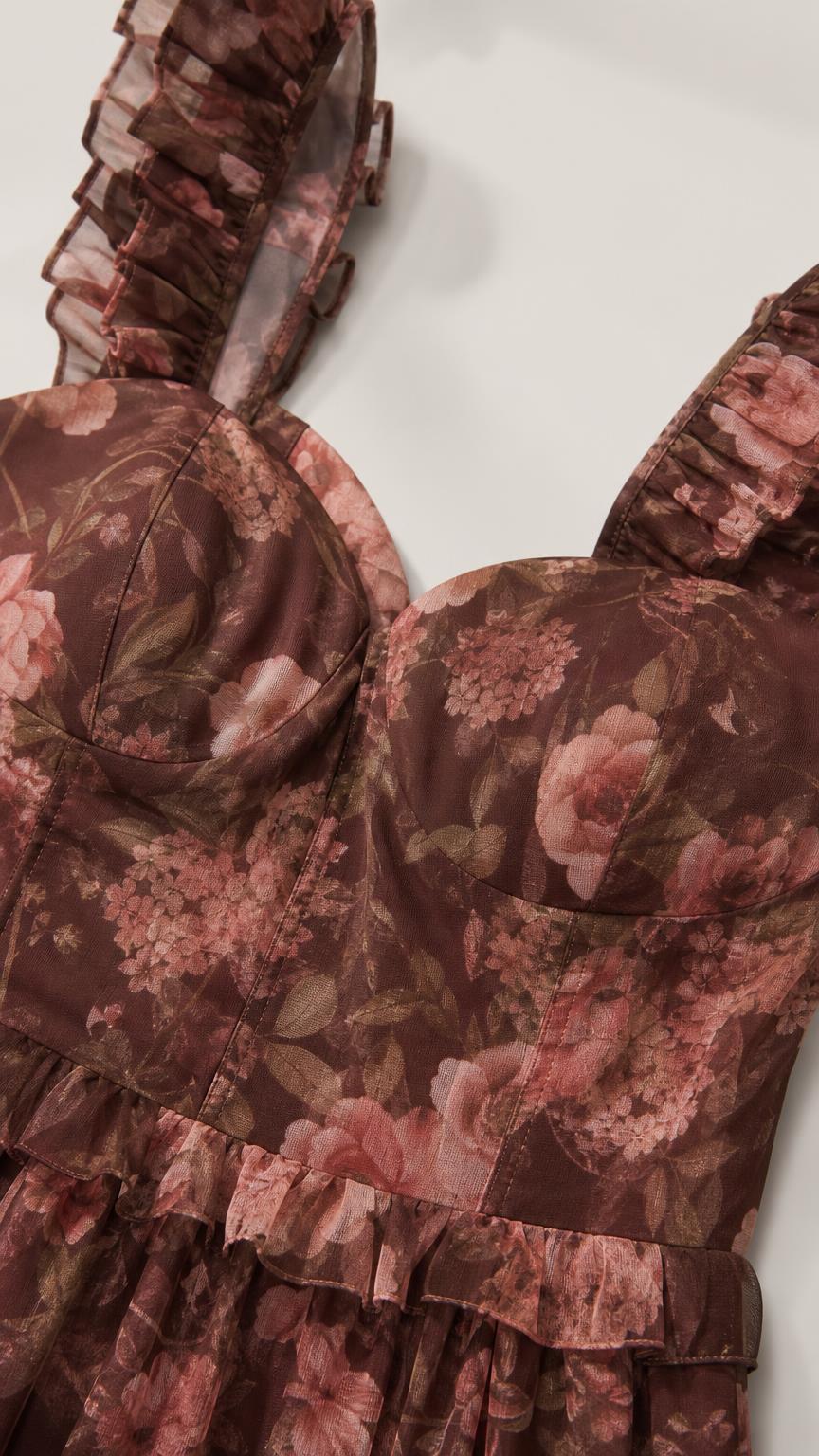 Close-up detail of bodice and ruffled straps on brown floral maxi dress