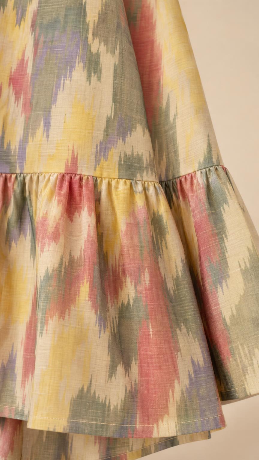 Close-up detail of the fabric texture and bottom ruffled hem