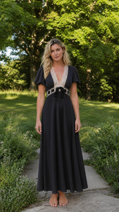 Front view of woman wearing black V-neck lace trim maxi dress