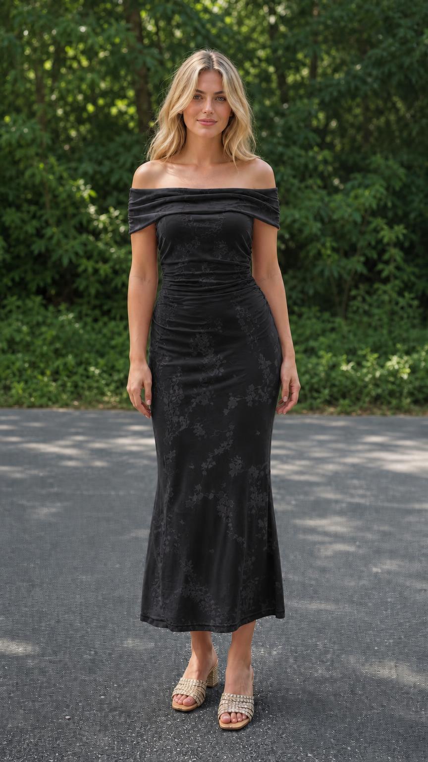 Model wearing black off-the-shoulder ruched floral midi dress, front view