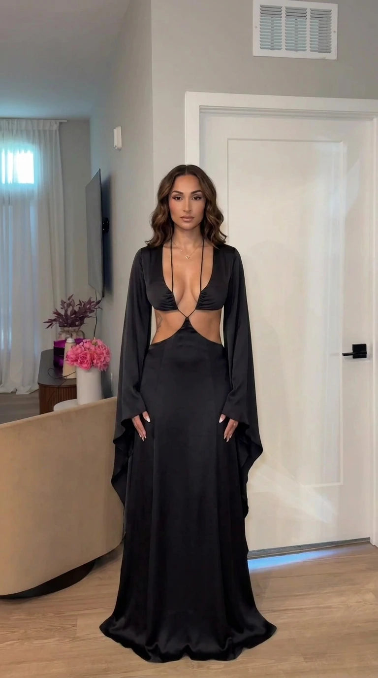 Front view of model wearing black cutout maxi dress