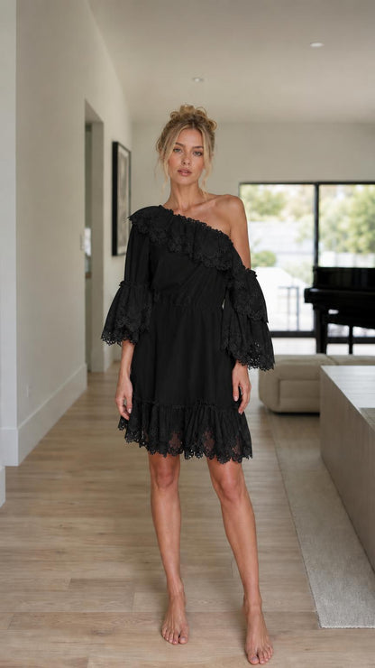 Front view of model wearing black one-shoulder ruffle lace mini dress