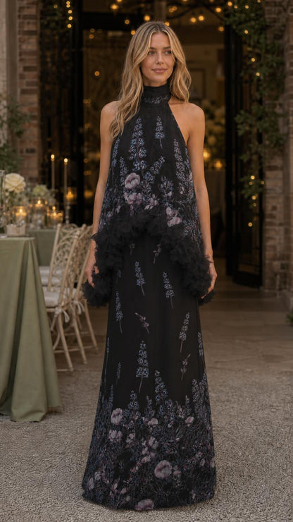 Model wearing black floral print ruffled halter maxi dress